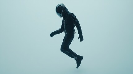 Leinwandbilder - A silhouetted figure in a jumpsuit and helmet appears to float in a minimalist, light blue space.