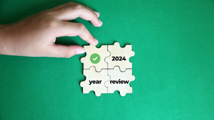 Business concept - Top view wooden block  writing 2024 YEAR REVIEW