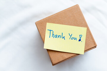 Aufkleber - Business package delivery with thank you note home office photograph indoor close-up gratitude concept