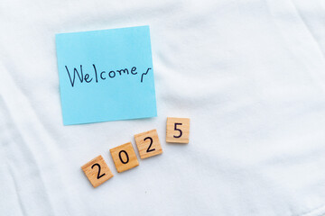 Poster - Welcome 2025 business goal setting home office motivational message bright environment close-up view future planning