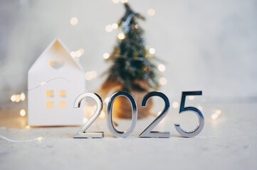 Wall Mural - New Year's lights gold and dark red colors bokeh background with glowing number 2025 and fireworks. Happy New Year concept for 2025.