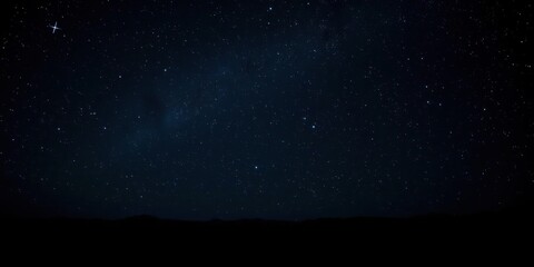 Wall Mural - dense cluster of bright stars against a dark canvas with subtle starlight reflections on the surroun