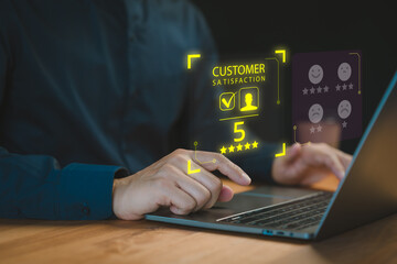Fototapete - A professional user interacts with a laptop, displaying a virtual interface for customer satisfaction ratings and reviews with a highlighted 5-star rating.