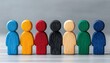 © TeteraX - Colorful wooden figures arranged in a line on a grey surface