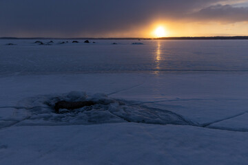 Wall Mural - Winter landscape with frozen Baltic sea at sunset