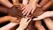 © aubriella - A group of hands of different colors and sizes coming together in a circle, fingers interlocked in unity