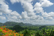 © ADDICTIVE STOCK - Lush Valley Landscape with Dramatic Sky and Vibrant Foliage