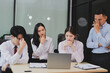 © ARMMY PICCA - Frustrated upset multiracial business team people sad with bad work result in report disappointed in corporate bankruptcy failure crisis worried of paperwork problem sit at table at office meeting