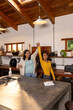 © Wavebreak Media - Grandmother and asian female teenager dancing joyfully in cozy kitchen, at home