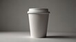 © mochalfin - Plain white disposable coffee cup with lid on a grey background.