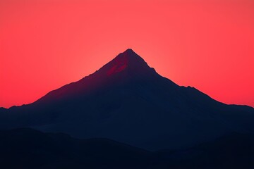 Wall Mural - Majestic mountain silhouette against a vibrant sunset sky