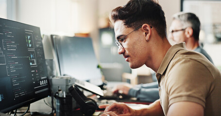 Fototapete - Computer, programming and web development with coder man in creative workplace for design. Coding, reading language and system infrastructure with employee person in office as website developer