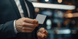 © FNB business illust - businessman holding a personal name white card privileges hight level personal payment purchase luxury class show membership modern office building