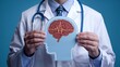 © Lahiru - A doctor holding a paper cutout of human head with brain with electric currents. epilepsy, migraine seizure disorder, neurological disorder, migraines, brain waves, mental health concept.