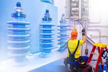 Poster - man electrician at work. repair of high-voltage electrical networks. insulators near power panel han