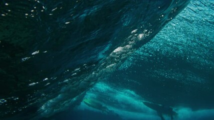 Wall Mural - Ocean wave breaks. Underwater view of a surfing spot in the Maldives