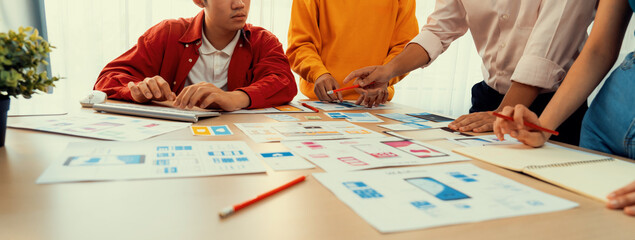 Poster - panorama banner of startup company employee planning on user interface prototype for mobile applicat