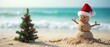 © lattesmile - Snowman wearing Santa hat on sandy beach with small Christmas tree. Christmas, holiday, tropical, beach theme, background with copy space