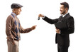 © Ljupco Smokovski - Businessman giving car keys to a senior man
