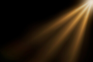 Wall Mural - orange spotlight effect or crepuscular rays isolated on black background