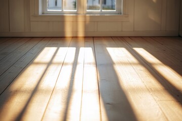 Poster - Sunlight illuminates a wooden floor, perfect for interior design and architecture projects