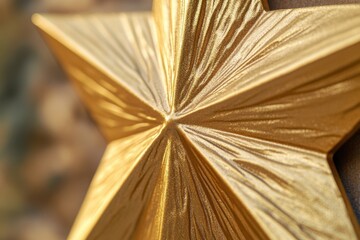 Aufkleber - A close-up shot of a shiny gold star on a wall