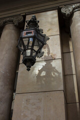 Wall Mural - a large antique street lamp hangs on the wall