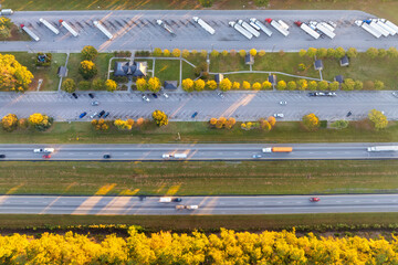 Rest area for semi trucks near busy interstate freeway. Truck stop place during hauling cargo