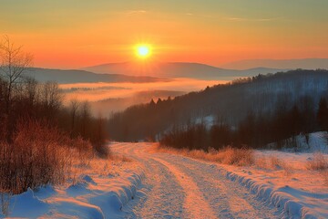 Poster - A winding dirt road leads through a snowy landscape towards a breathtaking sunrise over a misty valley.
