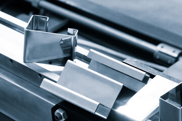 Poster - Metal products bent on a bending machine. Factory made products. Industrial concept background. Industrial metalworking concept background
