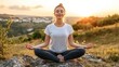 © phattharabodin - Woman Meditating in Nature at Sunset