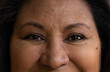 © Wavebreak Media - Smiling senior woman with warm, happy eyes in close-up view, expressing joy, at home