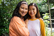 © Wavebreak Media - Grandmother and asian female teenager smiling together outdoors, enjoying family time in garden