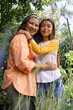 © Wavebreak Media - Grandmother and asian female teenager embracing in garden, enjoying time together outdoors
