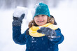 © Volodymyr - Happy Child playing with snow during snowfall. Snowball fight Child in winter clothes throw snowball. Winter children play with snow. Kid play with snowball. Winter kids face. Boy play snowball.