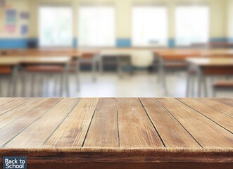 Poster - Empty wooden table in a classroom with blurred background of desks and chairs.