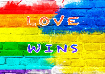 Poster - Colorful wall with the words love wins written on it