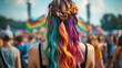 © JCreative - person with vibrant, braided hair extensions stands amidst lively festival crowd, showcasing colorful and creative hairstyle. atmosphere is festive and energetic