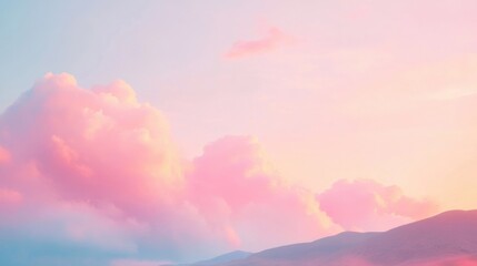 Wall Mural - puffy pink clouds float serenely in the evening sky, casting a dreamy ambiance at sunset near rugged
