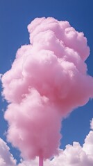 Poster - A pink cloud in the sky with a blue sky background