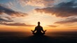 © hamzahalderad - A man sits in lotus pose on a hilltop, silhouetted against a vibrant sunset with a city skyline in the distance.