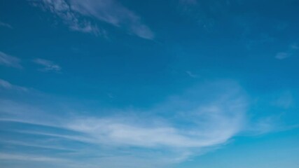 Wall Mural - blue sky with fluffy cloud time lapse on a sunny day 4k footage.