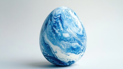 Poster - Intricately Marbled Blue and White Egg on a Soft Grey Background, Perfect for Celebrating Easter, Spring Themes, or Artistic Representations of Nature and Creativity