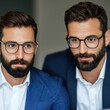 © Tonton1541 - Consultant Money Organization concept. Two men with beards and glasses in professional attire.