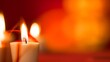© lisa - Burning Candles Glow Warmly in Red Orange Ambiance