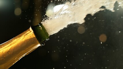 Fototapete - Celebration theme with splashing champagne on black background.