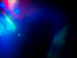 Wall Mural - a colorful, blurry background with a rainbow of colors. the colors are bright and vibrant, creating 