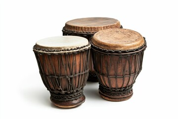 Three brown wooden djembe drums.