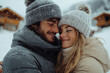 © Vovmar - Young couple hugging against the backdrop of a ski resort in snowy winter. Generated by artificial intelligence