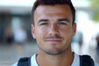 © HQAsset - Close-up Portrait of a Smiling Young Man with a Backpack, Outdoors